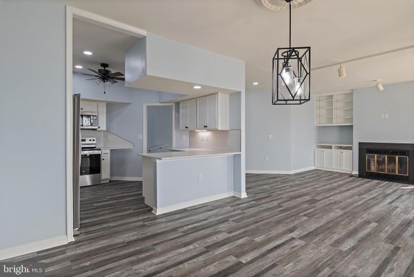 Fireplace, Interior, Kitchen, Pendant Lights, Recessed Lighting, Stainless Steel Appliances, Wood Texture Flooring