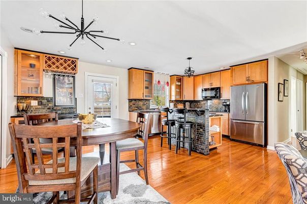 Dining room, Interior, Kitchen, Pendant Lights, Recessed Lighting, Stainless Steel Appliances, Wood Texture Flooring