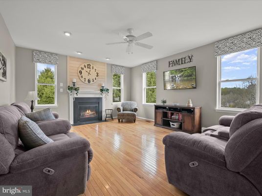 Fireplace, Interior, Living room, Recessed Lighting, Water, Wood Texture Flooring