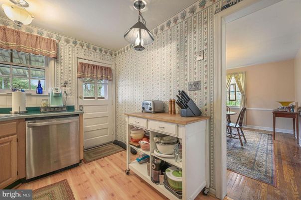 Dining room, Interior, Kitchen, Pendant Lights, Stainless Steel Appliances, Wood Texture Flooring