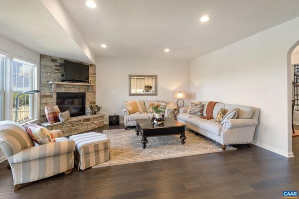 Fireplace, Interior, Living room, Recessed Lighting, Stone Walls, Wood Texture Flooring