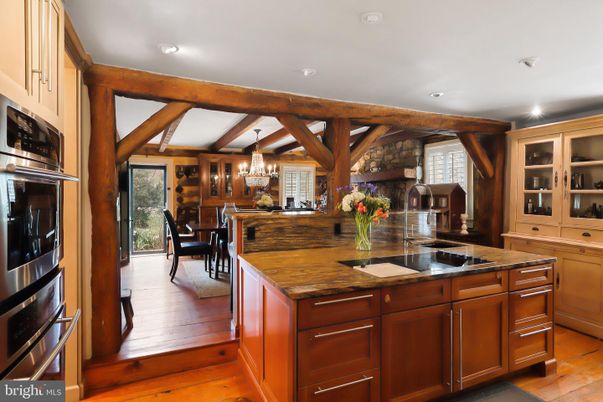 Chandelier, Dining room, Interior, Kitchen, Recessed Lighting, Stainless Steel Appliances, Wooden Beams, Wood Texture Flooring