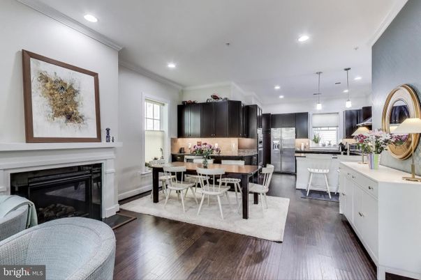 Dining room, Fireplace, Interior, Kitchen, Pendant Lights, Recessed Lighting, Stainless Steel Appliances, Wood Texture Flooring