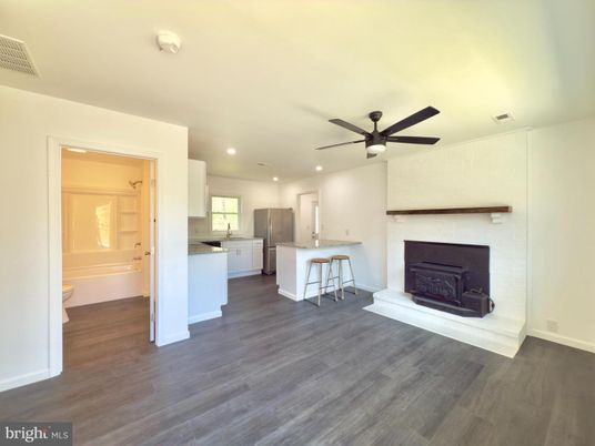 Empty room, Fireplace, Interior, Kitchen, Recessed Lighting, Wood Texture Flooring