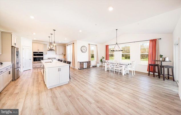 Chandelier, Dining room, Interior, Kitchen, Pendant Lights, Recessed Lighting, Stainless Steel Appliances, Wood Texture Flooring