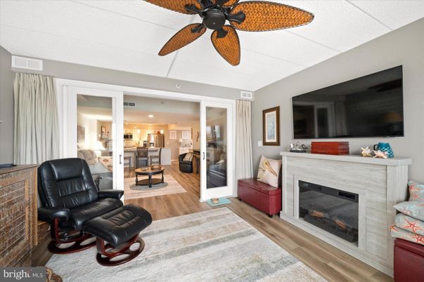 Fireplace, Interior, Kitchen, Recessed Lighting, Stainless Steel Appliances, Wood Texture Flooring