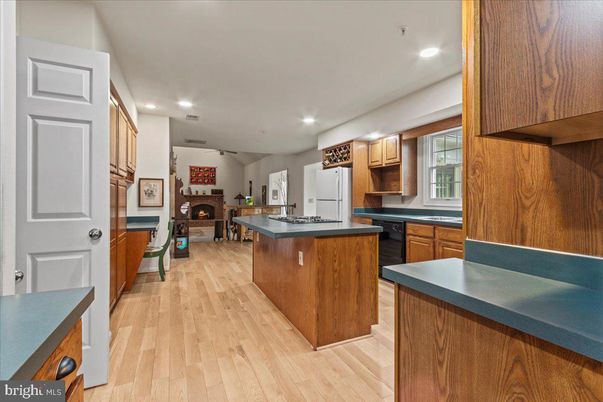 Fireplace, Interior, Kitchen, Recessed Lighting, Wood Texture Flooring