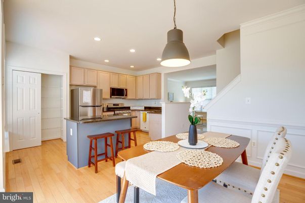 Dining room, Interior, Kitchen, Pendant Lights, Recessed Lighting, Stainless Steel Appliances, Wood Texture Flooring