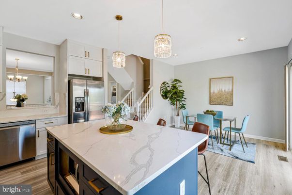 Chandelier, Dining room, Interior, Kitchen, Pendant Lights, Recessed Lighting, Stainless Steel Appliances, Wood Texture Flooring