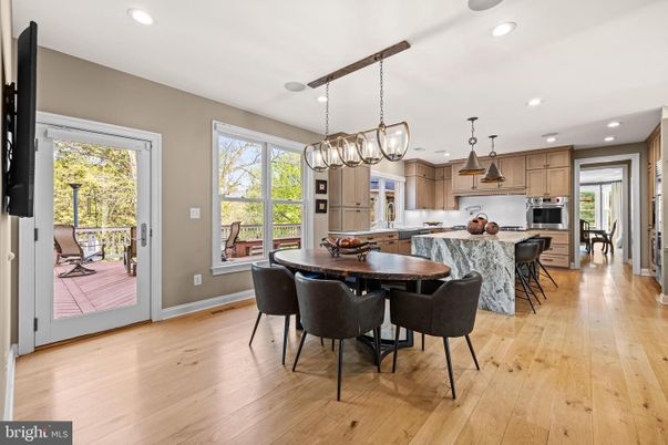 Chandelier, Dining room, Interior, Kitchen, Pendant Lights, Recessed Lighting, Stainless Steel Appliances, Wood Texture Flooring