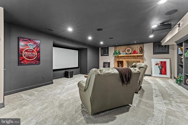 Fireplace, Interior, Living room, Projection Screen, Recessed Lighting, Stone Walls, Theatre Room