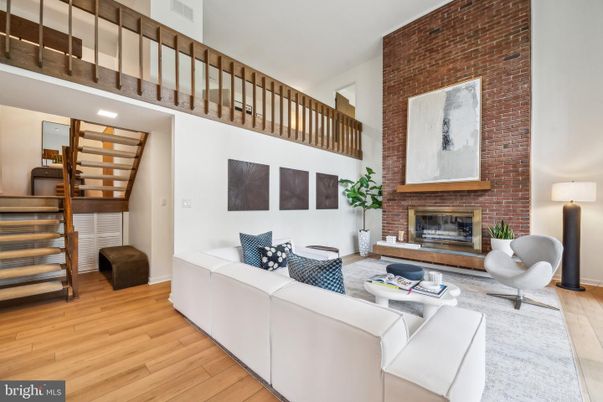 Fireplace, Interior, Living room, Recessed Lighting, Stone Walls, Wood Texture Flooring