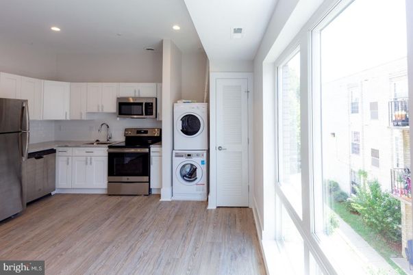 Interior, Kitchen, Recessed Lighting, Stainless Steel Appliances, Washer, Wood Texture Flooring