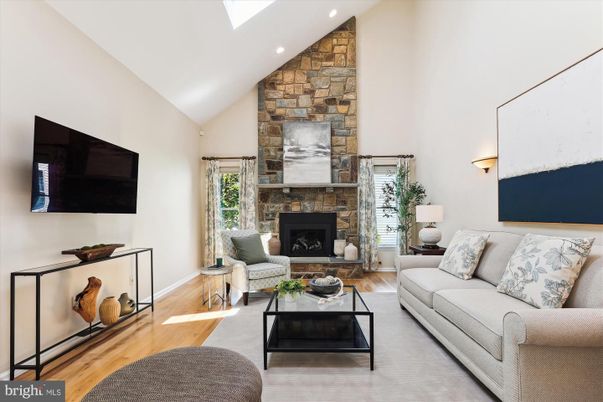 Fireplace, Interior, Living room, Recessed Lighting, Stone Walls, Wood Texture Flooring