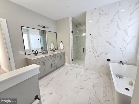 Bathroom, Dual Sink Vanities, Glass Shower, Interior, Marble, Marble Walls, Recessed Lighting