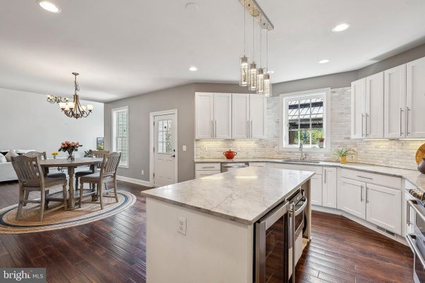 Chandelier, Dining room, Interior, Kitchen, Pendant Lights, Recessed Lighting, Stainless Steel Appliances, Wood Texture Flooring