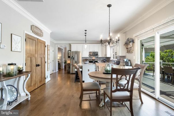 Chandelier, Dining room, Interior, Kitchen, Pendant Lights, Stainless Steel Appliances, Wood Texture Flooring