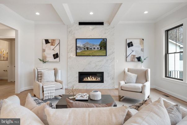 Fireplace, Interior, Living room, Marble Walls, Recessed Lighting, Wood Texture Flooring