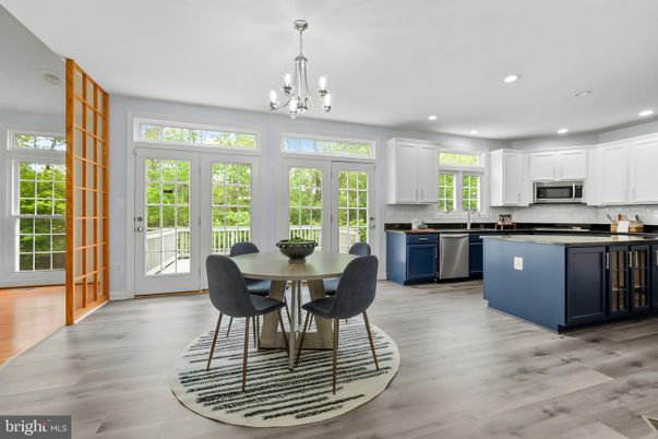 Chandelier, Dining room, Interior, Kitchen, Recessed Lighting, Stainless Steel Appliances, Wood Texture Flooring