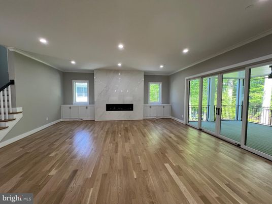 Empty room, Fireplace, Interior, Marble Walls, Recessed Lighting, Wood Texture Flooring