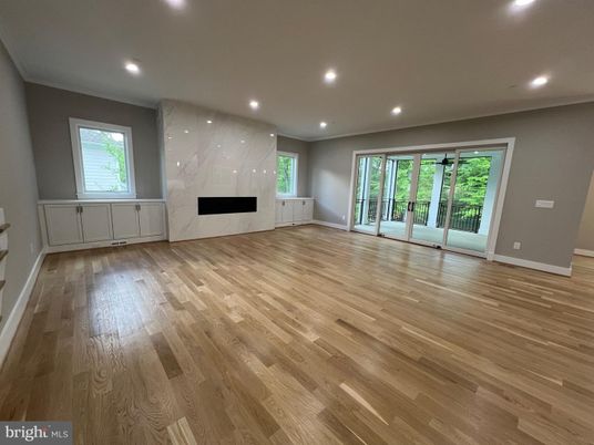 Empty room, Fireplace, Interior, Marble Walls, Recessed Lighting, Wood Texture Flooring