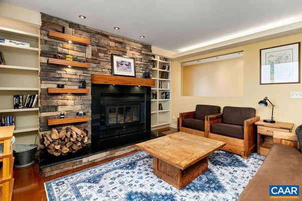 Fireplace, Interior, Living room, Recessed Lighting, Stone Walls, Wood Texture Flooring