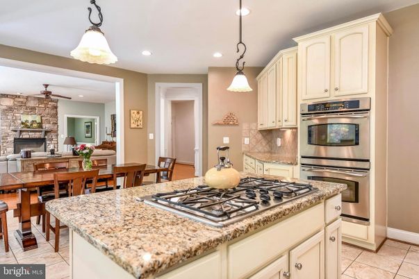 Dining room, Fireplace, Interior, Kitchen, Pendant Lights, Recessed Lighting, Stainless Steel Appliances, Stone Walls
