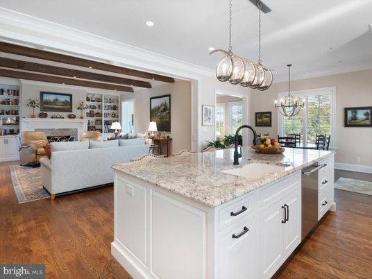 Chandelier, Dining room, Fireplace, Interior, Kitchen, Living room, Pendant Lights, Recessed Lighting, Stainless Steel Appliances, Wooden Beams, Wood Texture Flooring