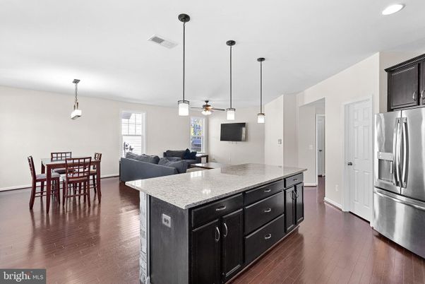 Dining room, Interior, Kitchen, Living room, Pendant Lights, Recessed Lighting, Stainless Steel Appliances, Wood Texture Flooring