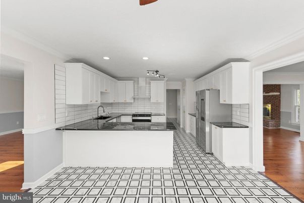 Fireplace, Interior, Kitchen, Recessed Lighting, Stone Walls, Wood Texture Flooring