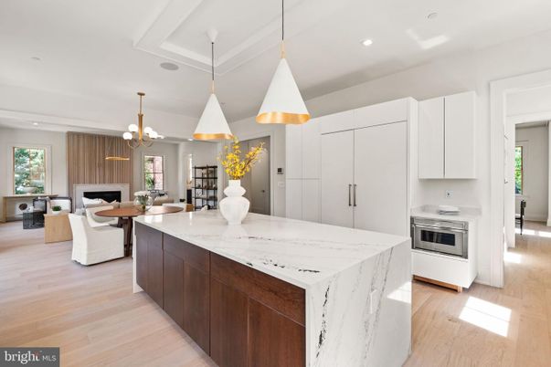 Chandelier, Dining room, Fireplace, Interior, Kitchen, Living room, Pendant Lights, Recessed Lighting, Stainless Steel Appliances, Wood Texture Flooring