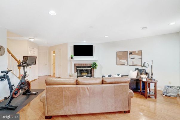Fireplace, Fitness Equipment, Interior, Living room, Recessed Lighting, Wood Texture Flooring