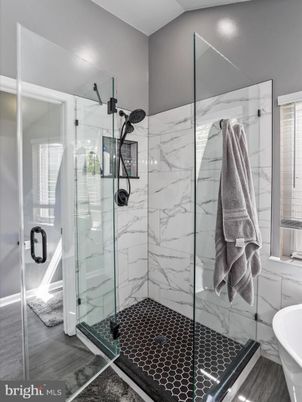 Bathroom, Free Standing Baths, Glass Shower, Interior, Marble Walls, Recessed Lighting, Wood Texture Flooring