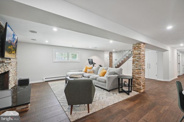 Fireplace, Fitness Equipment, Interior, Living room, Recessed Lighting, Wood Texture Flooring