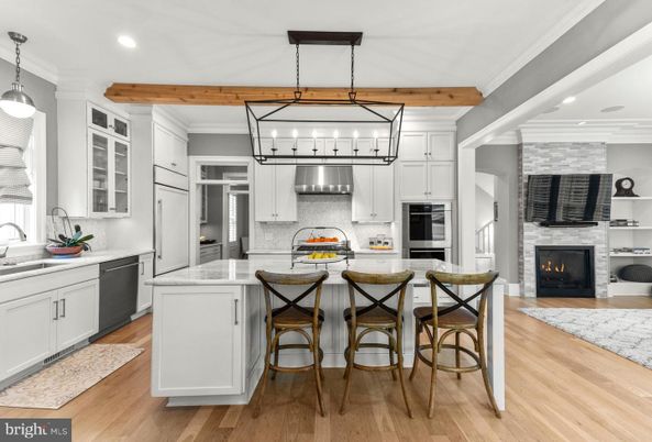 Fireplace, Interior, Kitchen, Pendant Lights, Recessed Lighting, Stainless Steel Appliances, Stone Walls, Wooden Beams, Wood Texture Flooring