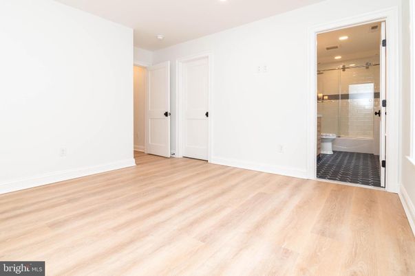 Bathroom, Empty room, Glass Shower, Interior, Recessed Lighting, Wood Texture Flooring