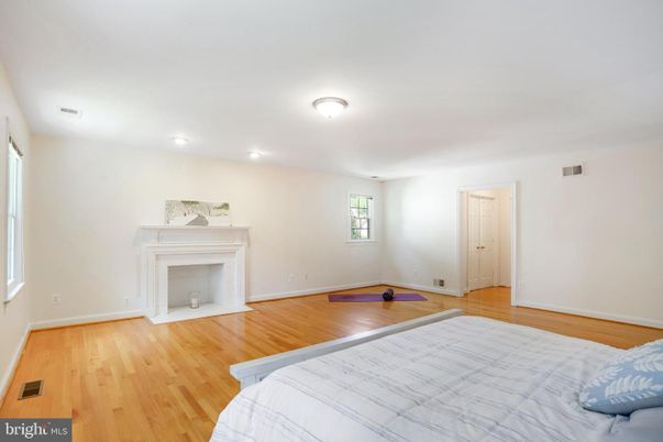 Bedroom, Fireplace, Interior, Recessed Lighting, Wood Texture Flooring
