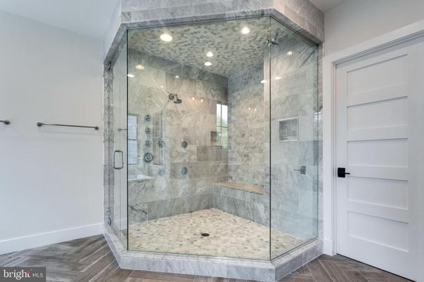 Bathroom, Glass Shower, Interior, Marble Walls, Recessed Lighting, Wood Texture Flooring