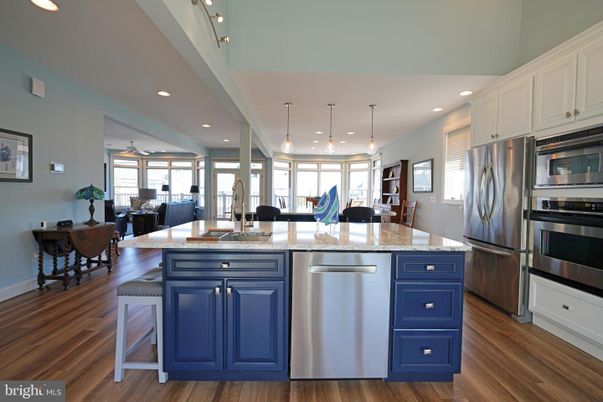 Dining room, Interior, Kitchen, Living room, Pendant Lights, Recessed Lighting, Stainless Steel Appliances, Wood Texture Flooring