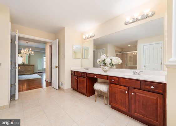 Bathroom, Chandelier, Dual Sink Vanities, Interior, Wood Texture Flooring