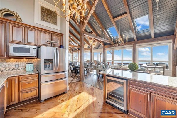 Chandelier, Dining room, Interior, Kitchen, Living room, Stainless Steel Appliances, Wood Texture Flooring