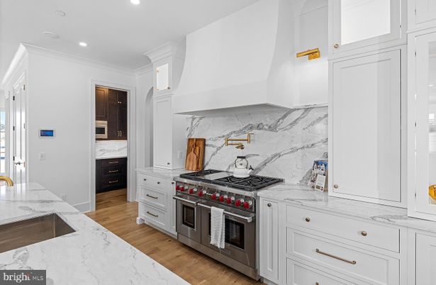 Interior, Kitchen, Marble Walls, Recessed Lighting, Stainless Steel Appliances, Wood Texture Flooring