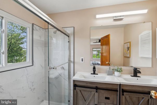 Bathroom, Dual Sink Vanities, Glass Shower, Interior, Marble Walls