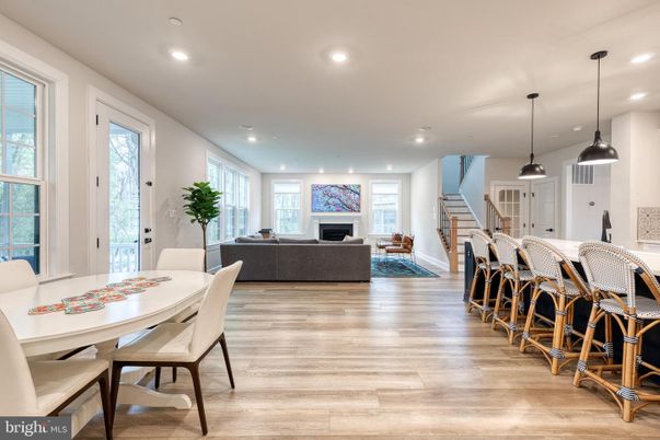 Dining room, Fireplace, Interior, Living room, Pendant Lights, Recessed Lighting, Wood Texture Flooring