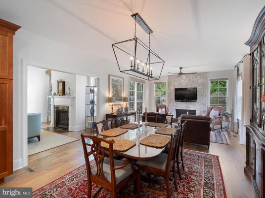 Chandelier, Dining room, Fireplace, Interior, Living room, Stone Walls, Wood Texture Flooring