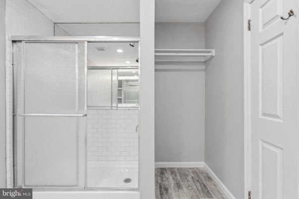 Bathroom, Glass Shower, Interior, Recessed Lighting, Walk-in Closets, Wood Texture Flooring