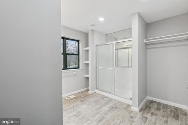 Bathroom, Glass Shower, Interior, Recessed Lighting, Walk-in Closets, Wood Texture Flooring