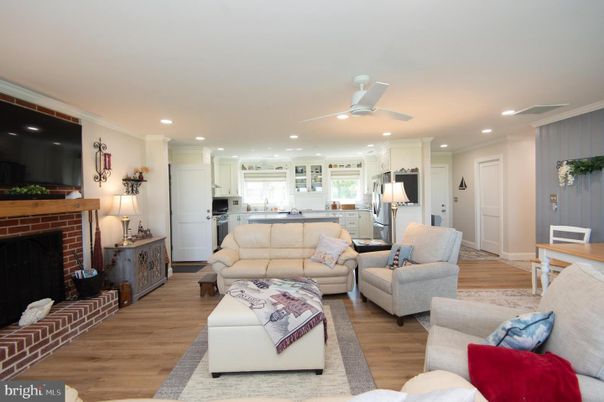 Fireplace, Interior, Kitchen, Living room, Recessed Lighting, Stainless Steel Appliances, Wood Texture Flooring
