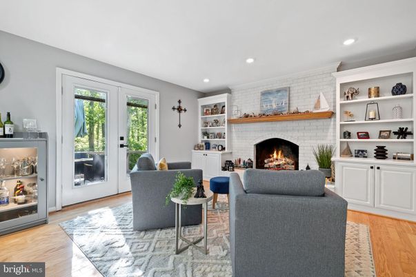 Fireplace, Interior, Living room, Recessed Lighting, Stone Walls, Wood Texture Flooring