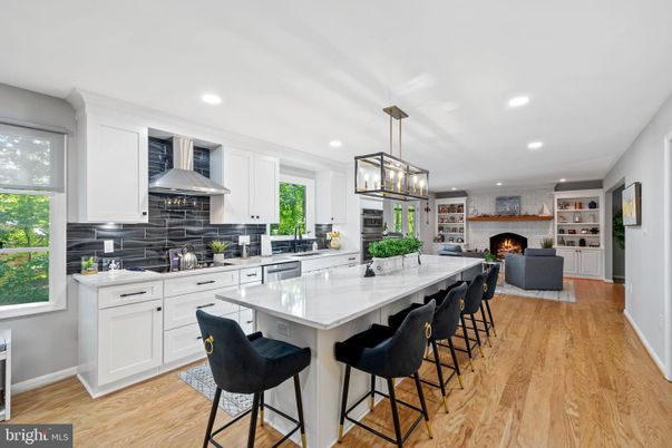 Fireplace, Interior, Kitchen, Living room, Pendant Lights, Recessed Lighting, Stainless Steel Appliances, Wood Texture Flooring